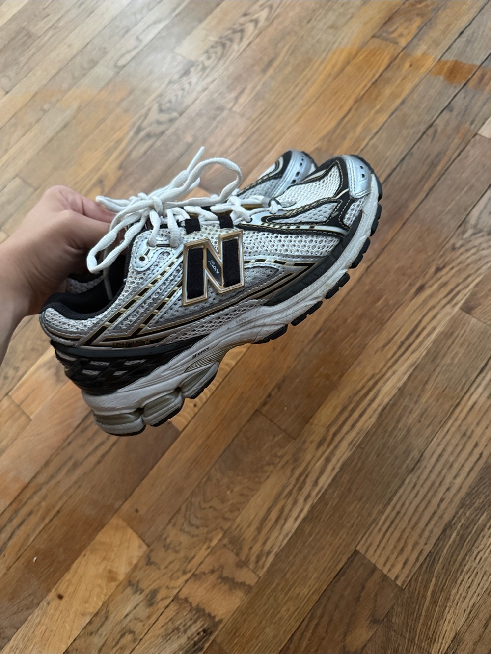 New Balance White Sneakers with Black and Gold Accents